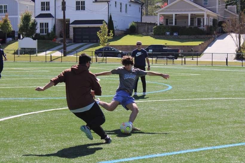 Players competing for the ball in a soccer match